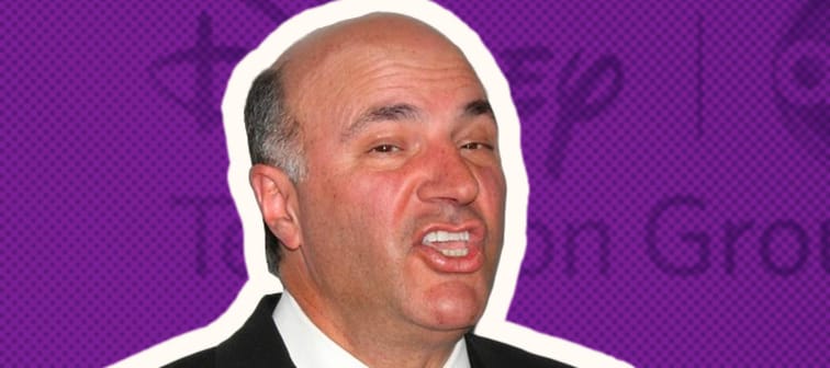 Kevin O'Leary in the middle of saying something standing in front of a Disney backdrop.