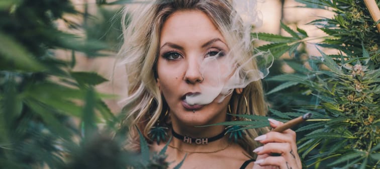 A person smoking weed in a garden