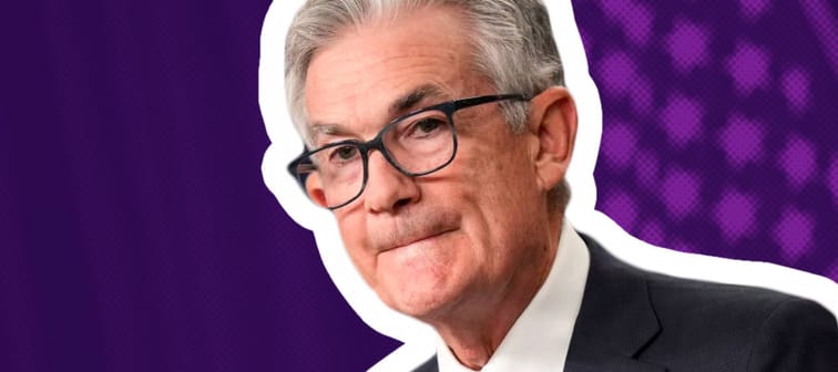 Federal Reserve Chairman Jerome Powell purses his lips while speaking at a press conference.