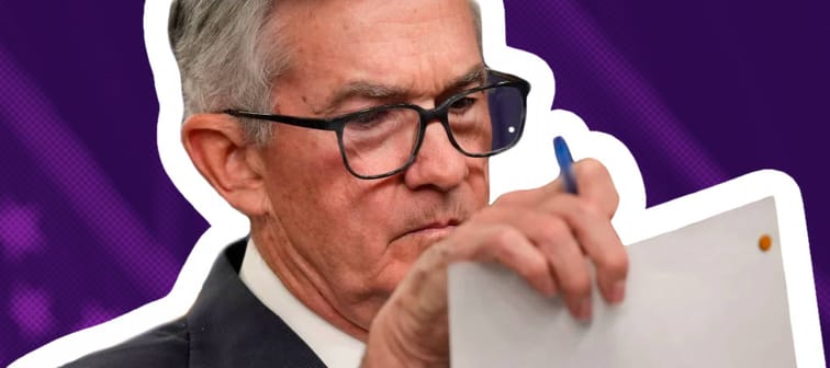 Federal Reserve Board Chairman Jerome Powell looks at notes while speaking during a news conference.