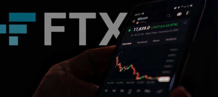 FTX logo and Bitcoin down trend chart displayed on smartphone.