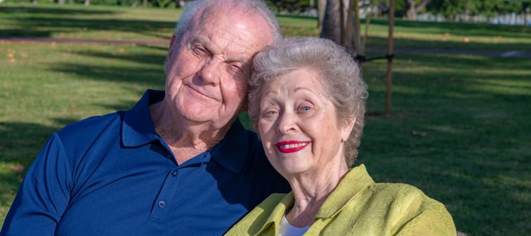 Older couple smiling at camera