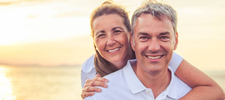 A Happy Romantic Mature Couple Enjoying Sunset on the Beach