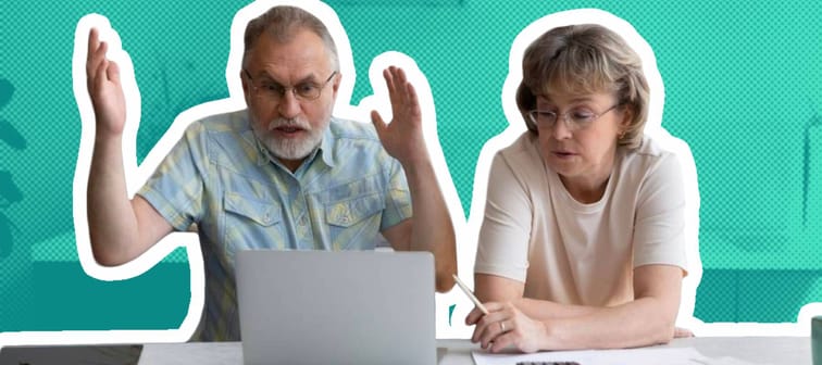 Stressed unhappy old senior family couple looking at laptop screen