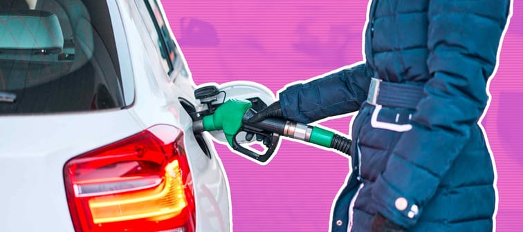 Girl in jacket fills petrol white car