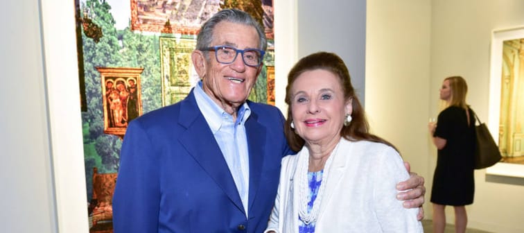 Robert Belfer and Renee Belfer pose smiling at an event at Art Basel Miami Beach.
