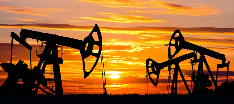 Oil Field. Oil pumps against the setting sun.