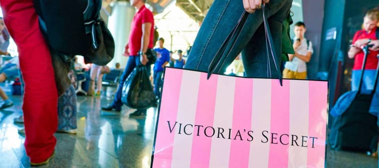 Person with Victoria's Secret shopping bag