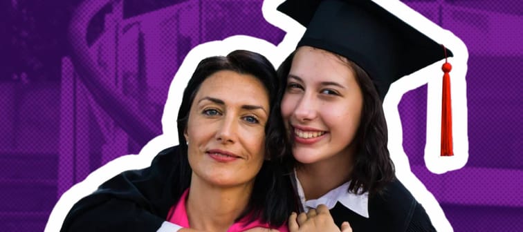 A happy mother and daughter pose while hugging, with daughter wearing a graduation cap and gown.