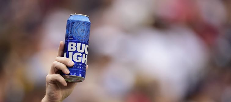 A fan holds up a can of Bud Light during New England Patriots game at FedExField on October 6, 2019. in Landover, Maryland.