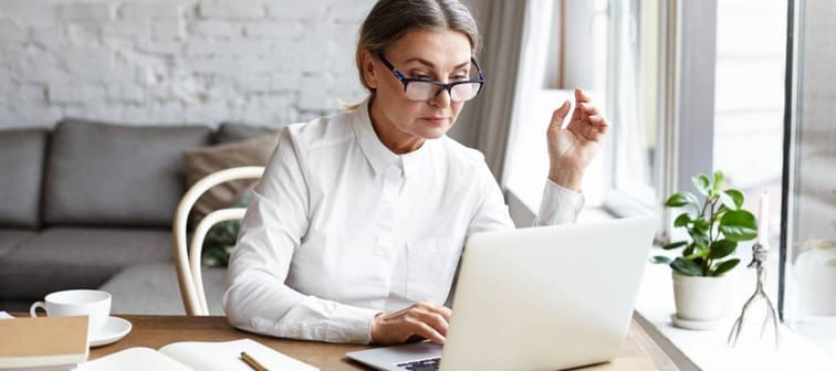 Older women using laptop at home