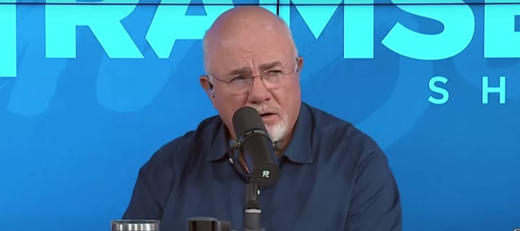 Dave Ramsey seem on the set of his show, making an incredulous face.