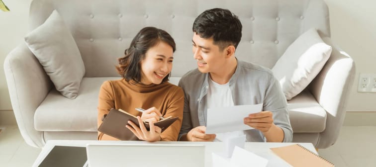 Young Asian man and woman stress with her business online shopping at office.