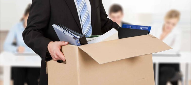 Close-up Of A Businessperson Carrying Cardboard Box During Office Meeting