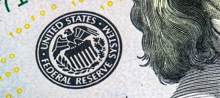 macro photo of federal reserve system symbol on hundred dollar bill, shallow focus