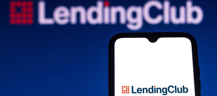 n this photo illustration the LendingClub logo is seen on a smartphone and a pc screen