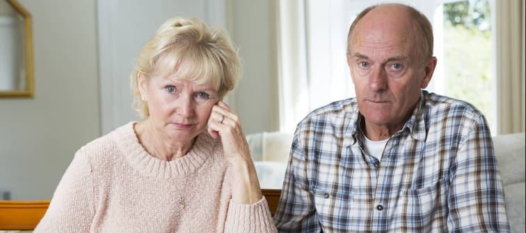 Concerned Senior Couple Reviewing Domestic Finances