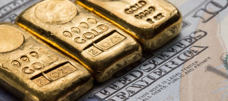 Multiple Gold Bullion on US Dollar Note