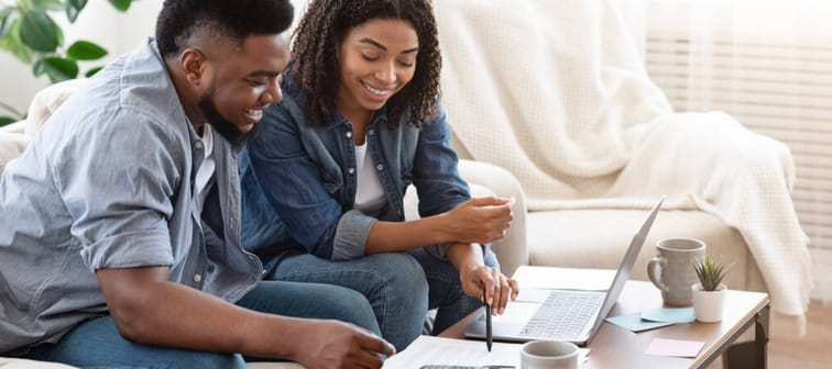 Young man and woman couple learning investing