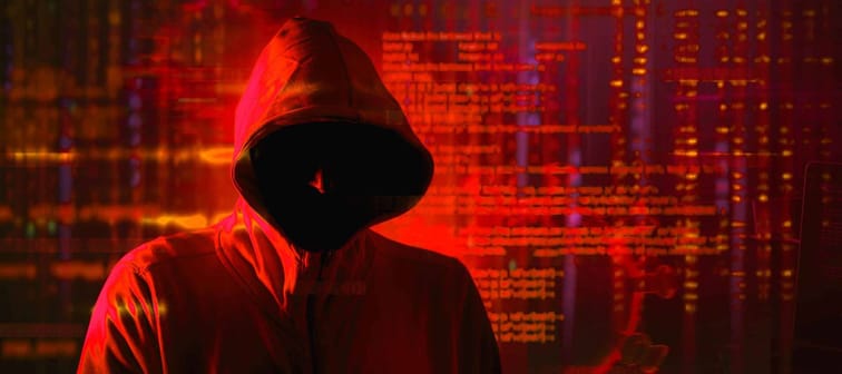 cyber security phishing   scam concept with hooded hacker during pandemic