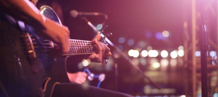 Guitarist on stage for background, soft and blur concept