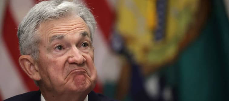 Jerome Powell seen close up, making an exaggerated frown.