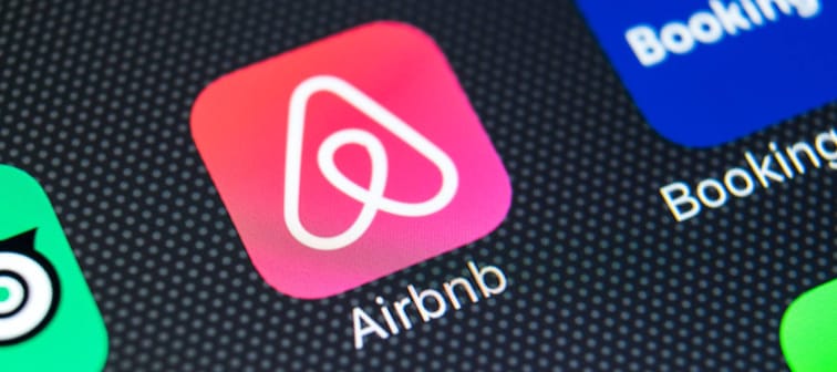 Airbnb app icon on mobile phone.