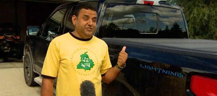 Dalbir Bana poses in front of his Ford pickup truck.