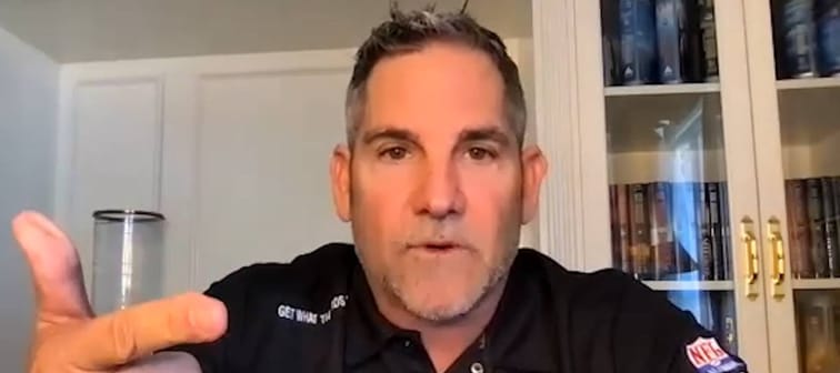 Grant Cardone seen in an office, speaking directly to the camera.
