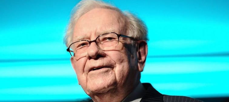 Philanthropist Warren Buffett is joined onstage by 24 other philanthropist and influential business people featured on the Forbes list of 100 Greatest Business Minds.