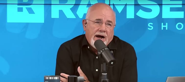 Dave Ramsey on set of his radio show, making an exaggerated facial expression.