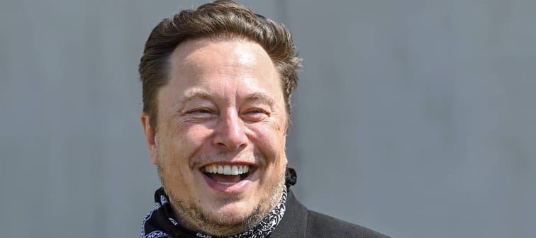 Elon Musk, Tesla CEO, stands at a press event on the grounds of the Tesla Gigafactory.