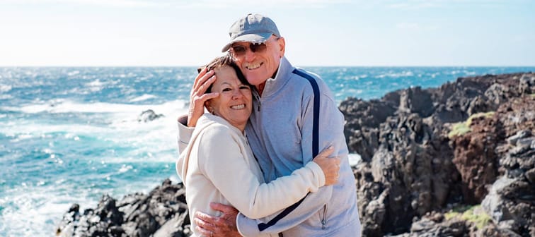 A happy older couple enjoy a sunny day.