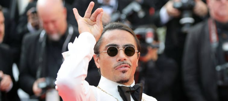 Salt Bae attends the screening of "The Traitor" during the 72nd annual Cannes Film Festival on May 23, 2019, making his signature hand gesture.