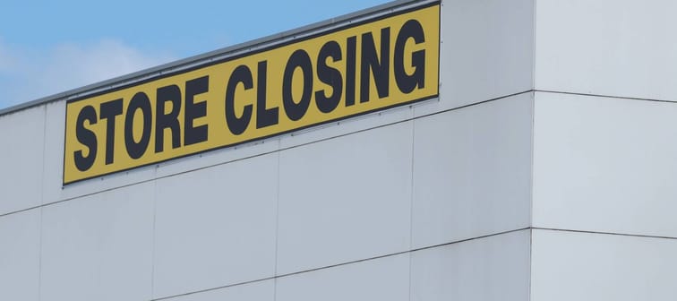 Store Closing black on yellow letters on a white cladded industrial building, Melbourne 2016