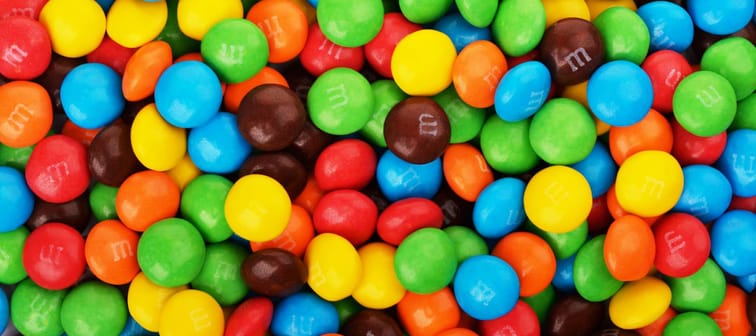 SAMARA, Russian Federation - April 29, 2017: M&M's candies. M&M's produced by Mars, Incorporated. Close up of a pile of colorful chocolate coated candy, chocolate pattern, candies background