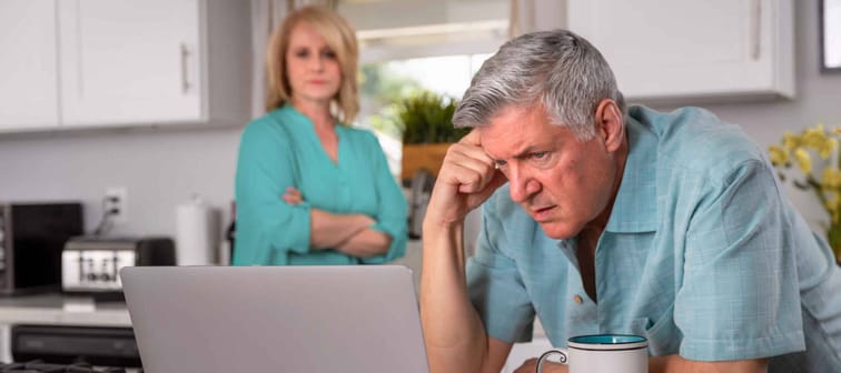 Older senior married couple in distress, concerned over mortgage, finances, financial earnings, debt