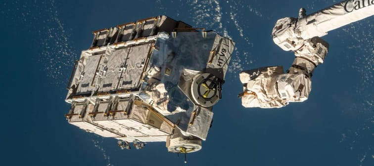 An external pallet packed with old nickel-hydrogen batteries is released from the International Space Station.