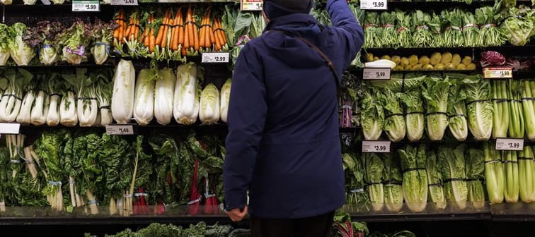 A customer shops for produce at a grocery store In Toronto on Friday, Feb. 2, 2024. The federal NDP is accusing Ottawa of misrepresenting a task force announced last fall that it said would i