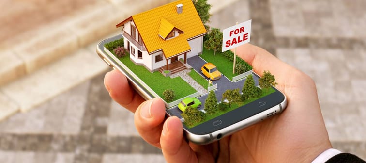 Smartphone application for online searching, buying, selling and booking real estate. Unusual 3D illustration of beautiful house on smartphone in hand