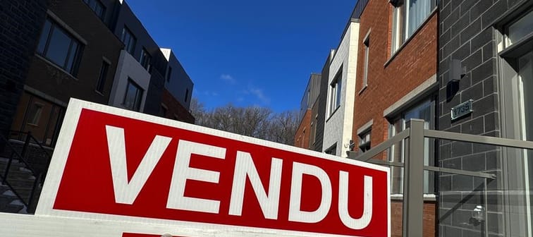 A "sold" sign is shown in a new housing development in Lasalle, a borough of Montreal, Monday, Feb. 19, 2024. 
The Quebec Professional Association of Real Estate Brokers says Montreal-area ho