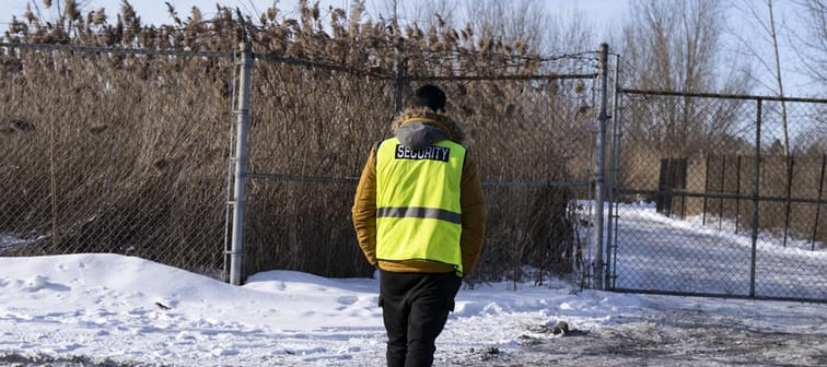 Security guards the entrance to the construction site of the new EV battery plant, Northvolt, in Saint-Basile-le-Grand, east of Montreal, Quebec, Friday, Jan. 19, 2024. The company behind the