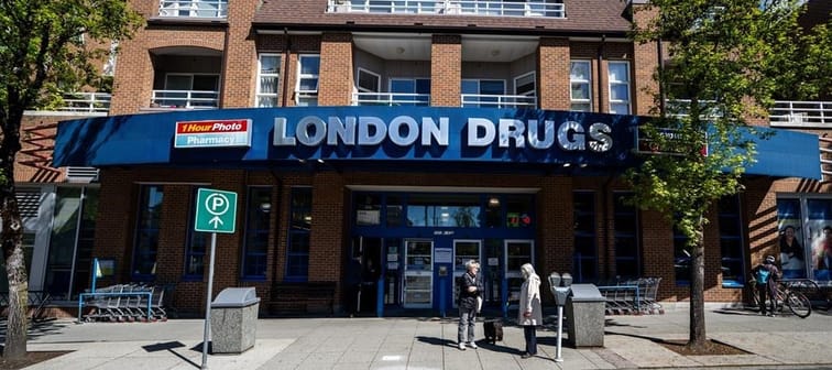 People wait outside of the London Drugs Kerrisdale location on Monday, April. 29, 2024. The president of London Drugs has issued a letter apologizing for a cybersecurity incident that forced 