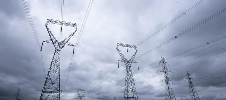 Power lines are seen against cloudy skies near Kingston, Ont. , Wednesday, Sept. 7, 2022 in Ottawa. The Alberta Utilities Commission is fining another power plant in the province for operatin