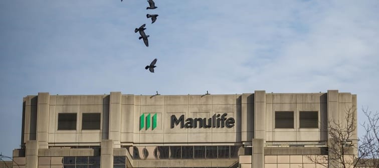Signage is seen on Manulife Financial Corp.'s office tower in Toronto, Tuesday, Feb. 11, 2020. Manulife Financial Corp. says it expects to ramp up its share buyback program this year as it sh