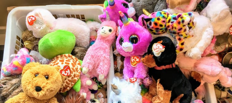 A laundry basket full of Beanie Babies stuffed animals