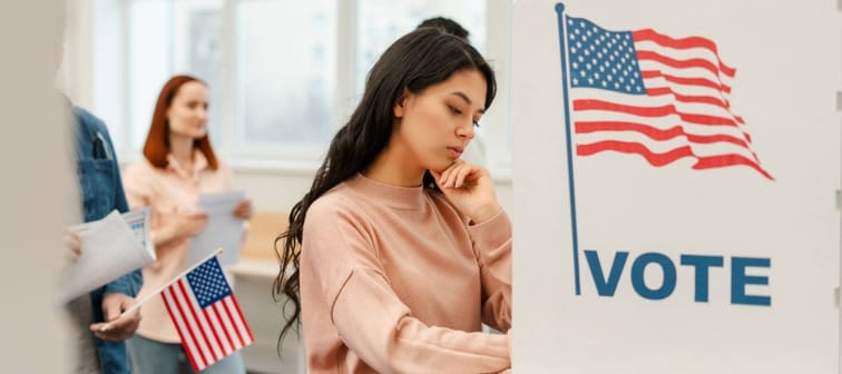 Young voter voting at polling station