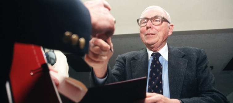 Charlie Munger attends a book signing.