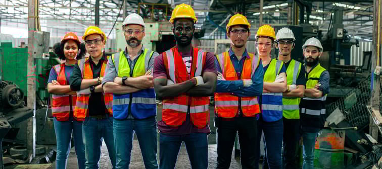 Workers with arms folded