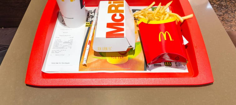 Berlin, Germany - August 17, 2018: McDonald McRib menu with french fries and Coca-Cola.
